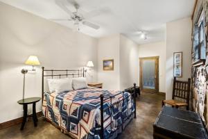 a bedroom with a bed and a ceiling fan at Mission Rock 2 in Ouray