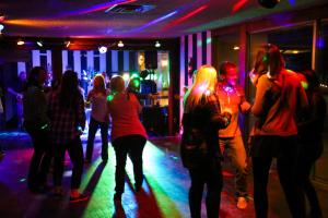 a group of people dancing in a club at Boyne Mountain Resort in Boyne Falls