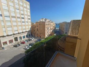 a view of a city from the balcony of a building at Sant' Agostino Suite in Trapani