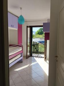 a hallway with a room with a bed and a balcony at Casa Vacanze Daniele in Pontecagnano