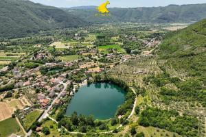 an aerial view of a town and a lake at Appartamento Villa Reale in Castel SantʼAngelo