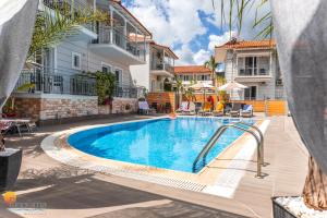 a swimming pool with a slide in a apartment at Panorama Apartments in Chrani