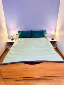 a bedroom with a large bed with two night stands at Large Family Chalet Mountain Views in Olette