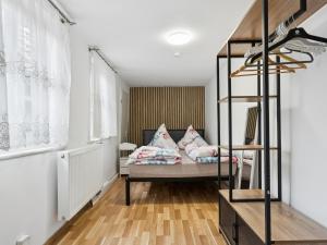 a bedroom with a bunk bed with pink pillows at Auszeit in Goslar