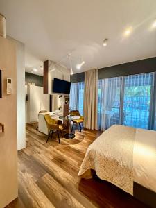 a hotel room with a bed and a desk at Desimo Home in Piła