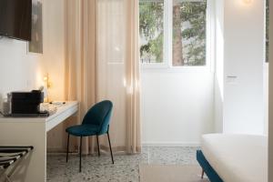 a room with a desk and a chair next to a window at Marcello's Como Lake in Como