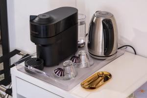 a coffee maker sitting on top of a counter at Marcello's Como Lake in Como