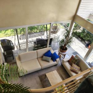 an overhead view of a living room with a couch at BluVilla in Malvaglia +6 photos