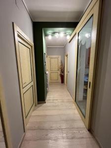 a hallway with a door and a hallwayngthngthngthngthngthngthngthngth at Vicolo in Fiore House in Orvieto