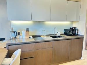a kitchen with a counter top with a stove top oven at Seabreeze Baku White Residence Studio, Terrace in Baku