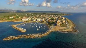 an aerial view of a harbor with boats in the water at Διαμέρισμα τριών ατόμων in Filiatra