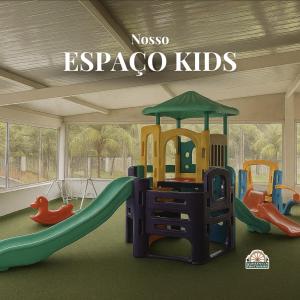 a play room with a slide and a playground at Querência Pantaneira in Miranda