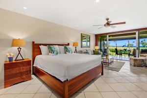 a bedroom with a bed and a living room at Maui Eldorado Condo J221 in Kaanapali +39 photos