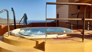 a hot tub on the roof of a house at La Envía Terraza in La Envia