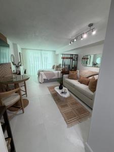 a living room with a couch and a bed at Luxury executive Studio in Brickell in Miami +31 photos