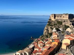 an aerial view of a town next to the ocean at Casetta IV Vico- Chianalea in Scilla