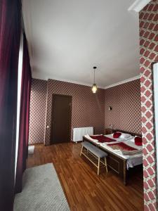 a room with a bed in the middle of a room at Panorama in KUTAISI in Kutaisi