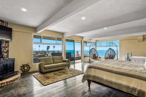 a bedroom with a bed and a view of the ocean at Tropical Retreat with Ocean Views - Steps from the sand with alfresco dining in Rosarito