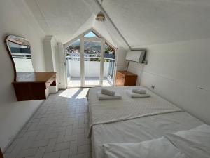 a bedroom with a bed with two towels on it at Double Comfort Marmaris in Marmaris +62 photos