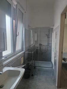 a bathroom with a shower and a sink and a tub at B&B Villa AVE in Seriate