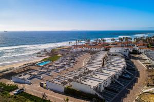 an aerial view of a beach with a resort at Dog-friendly Home with Partial Ocean View, Heated Pool, Rooftop Terrace in Rosarito