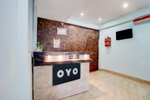 a lobby with an ovo sign on the wall at Hotel O Royal Inn Hotel in Dīgha