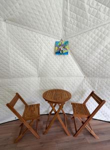 two chairs and a table in a tent at Mtirala Yurt in Batumi