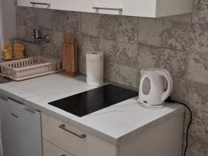 a kitchen with a counter top with a sink at Rooms Radic in Dubrovnik +50 photos