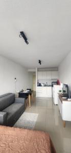 a living room with a couch and a table at Monoambiente como en casa in Montevideo