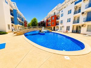 a large swimming pool in the middle of a building at Sunny Day 3 - Pool and Chill in Sunny Beach