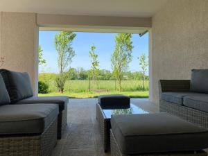 a living room with two couches and a table at Il Falcineto in Pesaro