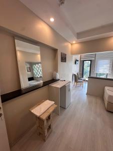 a living room with a counter and a table in a room at Lotus 4 Mevsim Otel in Ayvalık +28 photos