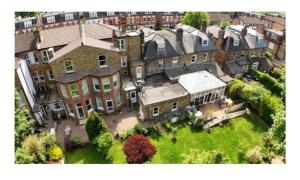 an aerial view of a large house with a yard at Catherine Lodge Finchley in Whetstone