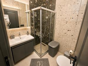 a bathroom with a shower and a sink at Asil house in Istanbul +28 photos