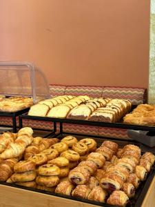 a display case filled with lots of different types of pastries at Tota Marinou in Agioi Apostoli +8 photos