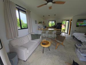 a living room with a couch and a table at Suerte Bella in San Carlos