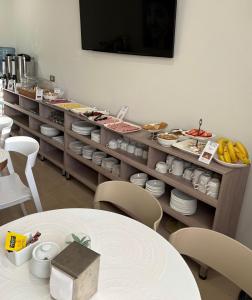a restaurant with a buffet of food on display at Hotel Frontera in Antofagasta +17 photos
