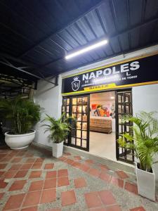 a store with potted plants in front of it at NaPoles valledupar Hotel in Valledupar +34 photos