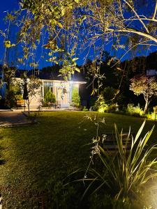 a house with a garden at night at Krupitskiy House in Chakvi