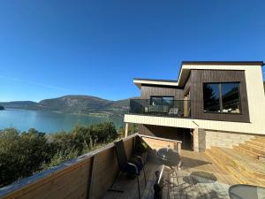 a house with a view of the water at Olden Apartment with Panorama view in Olden +17 photos