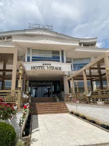 a hotel mirage with stairs in front of a building at Mirage Hotel & SPA - Struga in Struga