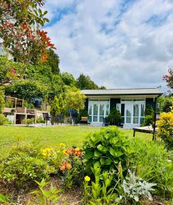 a house with a garden in front of it at Krupitskiy House in Chakvi