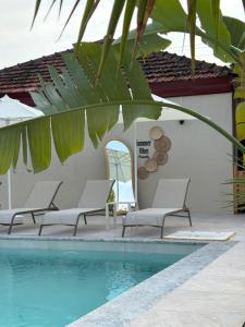 a group of chairs next to a swimming pool at Hanımın Çiftliği Tents&Drinks in Fethiye