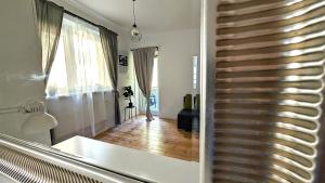a staircase in a room with a wooden floor at G-8HOSTEL Gdynia in Gdynia