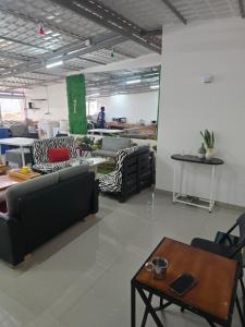 a living room with couches and a coffee table at My Flat 0 in Praia