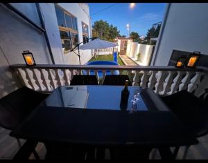 a black table and chairs on a balcony at Holiday Home Marković in Bibinje