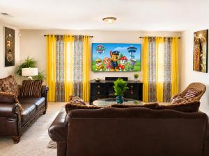 a living room with a couch and a table at Guest House Haven with Gazebo in Riverdale