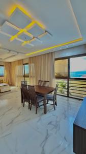 a dining room with a table and two chairs at zahara appartement in Tangier