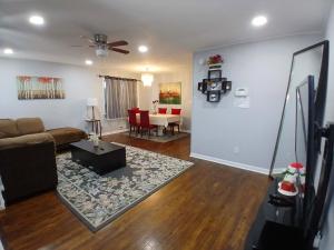 a living room with a couch and a table at 16 sycamore rd in Bayonne