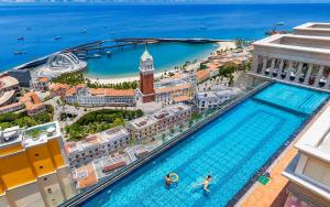 an overhead view of a large swimming pool in a city at Love & Peace Apartment in Phú Quốc